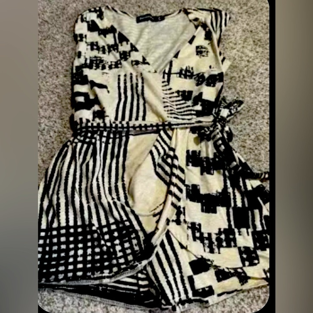 Betabrand black and tan geometric one piece wrap skort romper.
